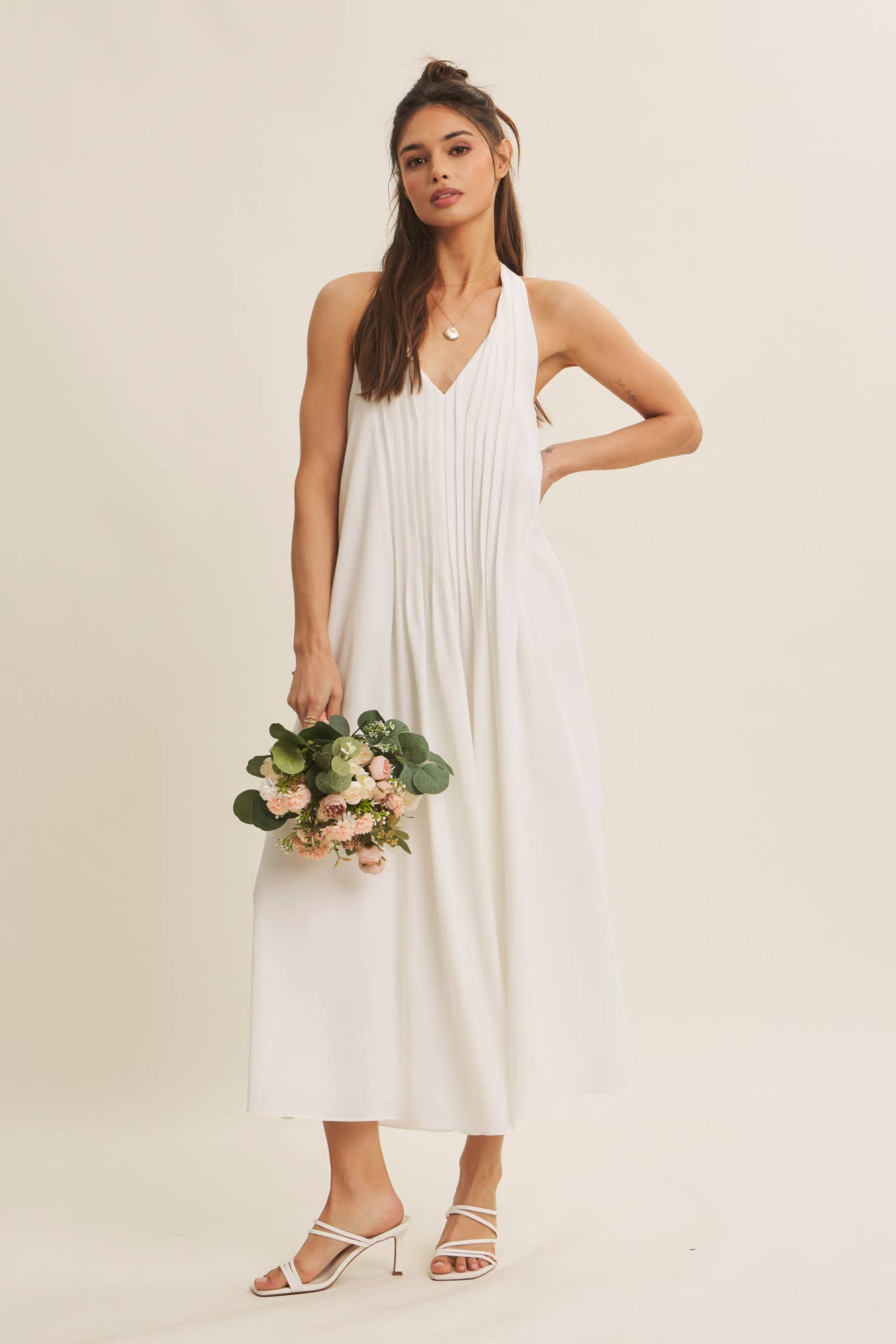 SOFTLY FLOWING PLEATED ELEGANCE HALTER MIDI DRESS: OFF WHITE / S | Stella & Grace Boutique .