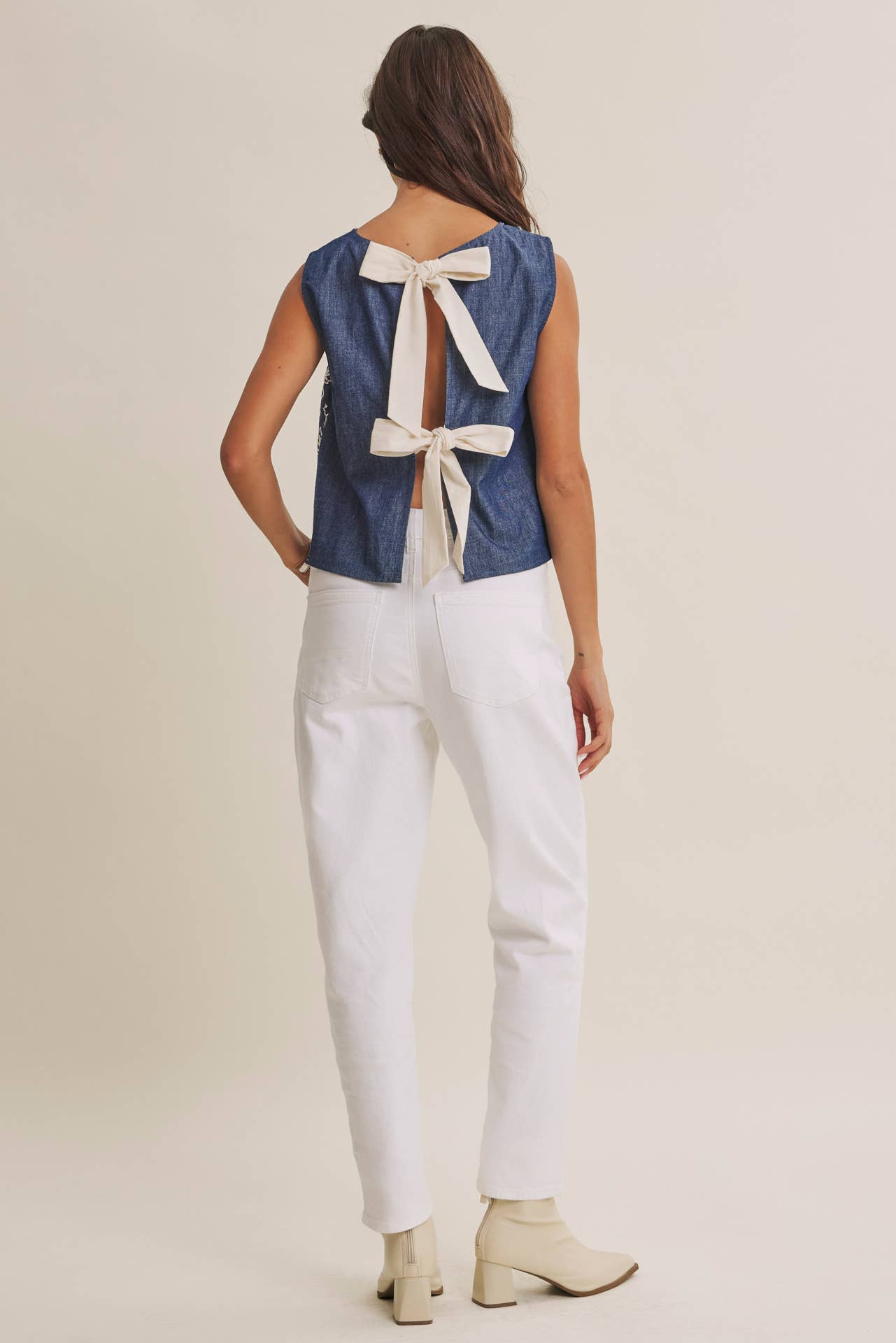 COASTAL DAY CHAMBRAY EMBROIDERED BLOUSE WITH BACK BOW: DENIM BLUE / M | Stella & Grace Boutique .