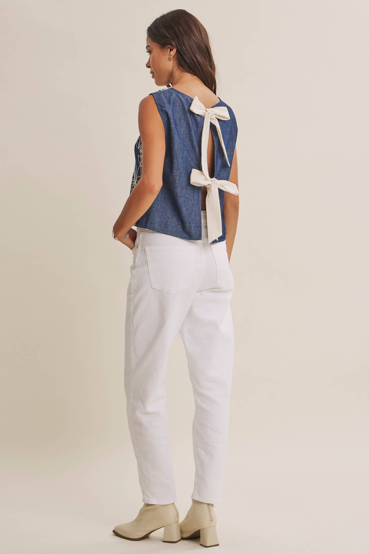 COASTAL DAY CHAMBRAY EMBROIDERED BLOUSE WITH BACK BOW: DENIM BLUE / M | Stella & Grace Boutique .